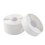 Two rolls of white tape on a white background